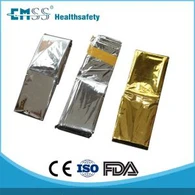 Manta de papel alumínio de emergência ouro/prata